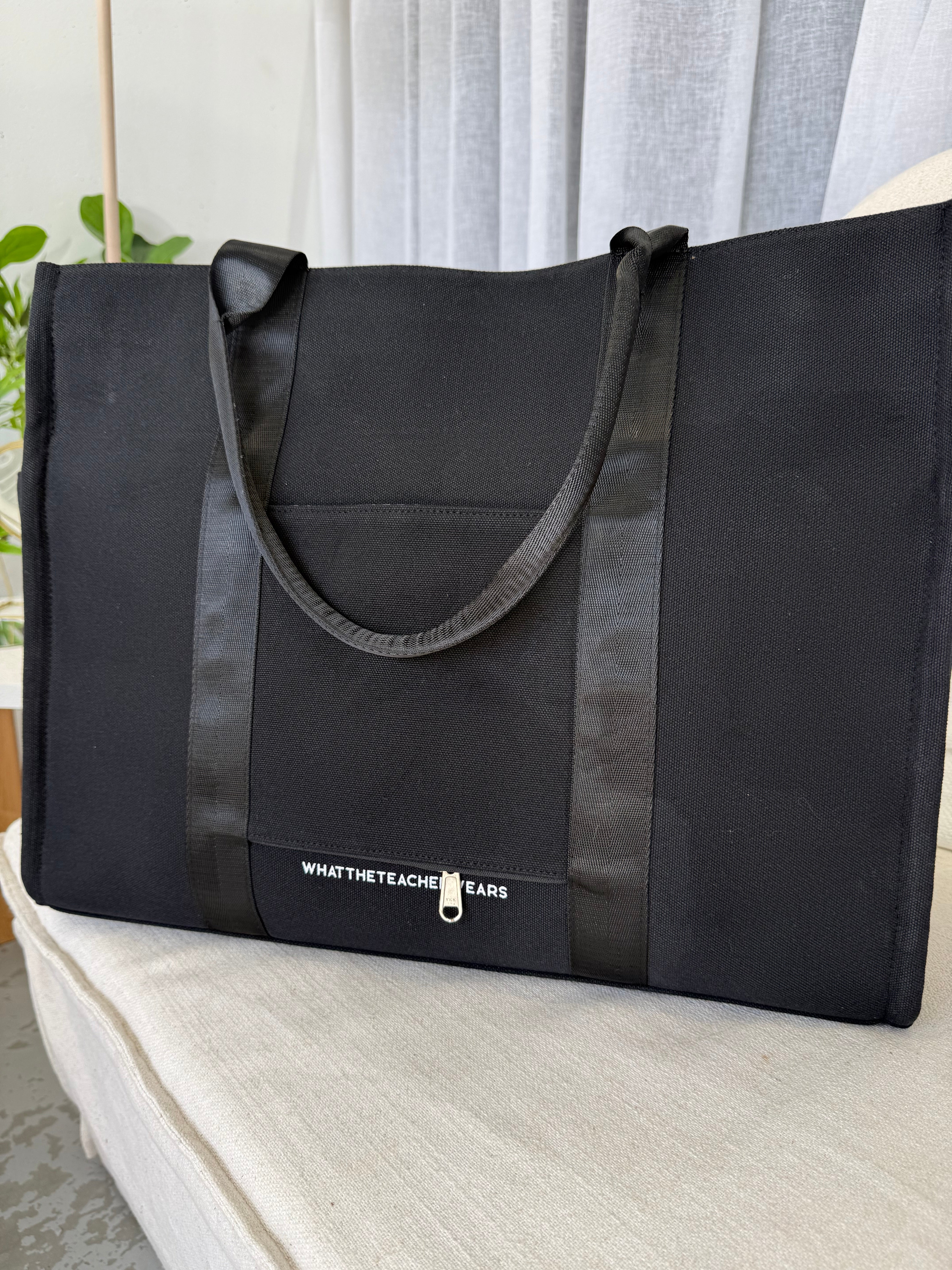 Plain Tote in black, a thick canvas work tote with multiple interior pockets